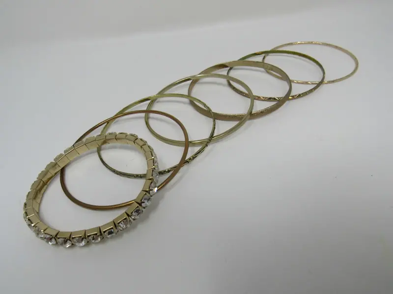 7-Piece Gold Bangle Set With Crystal Accents – Designer Stackables 1